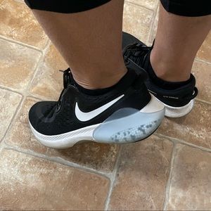 Woman’s NIKE Joyride running shoes. Size 9.5. Black, white with pebbles.